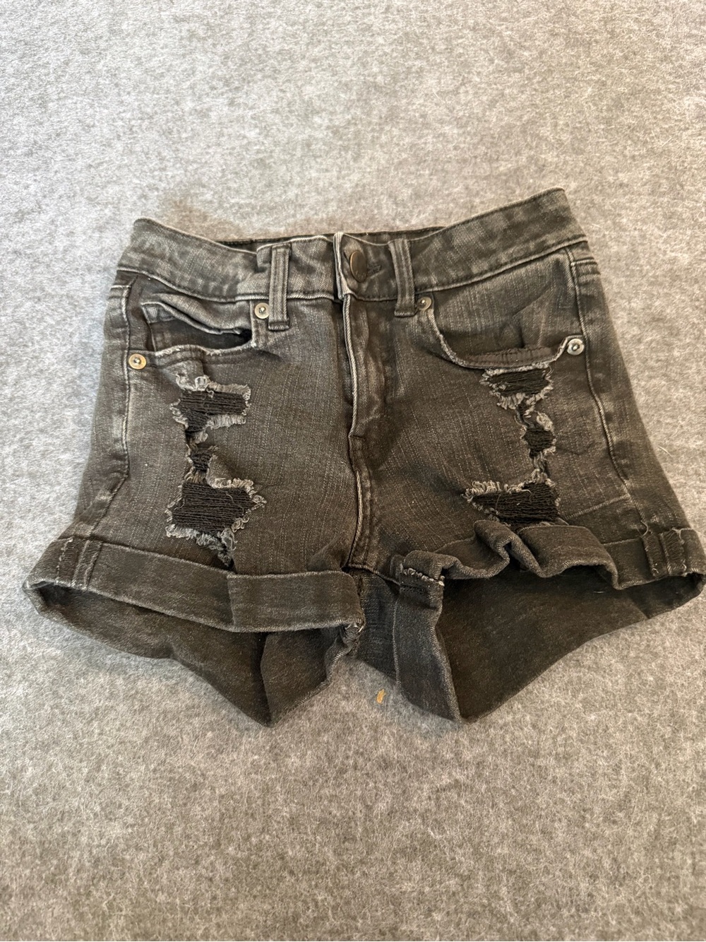 High-Rise Black Distressed Rolled-Hem Jean Shorts